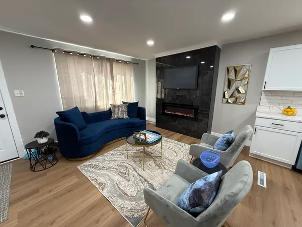 a living room with furniture and a flat screen tv