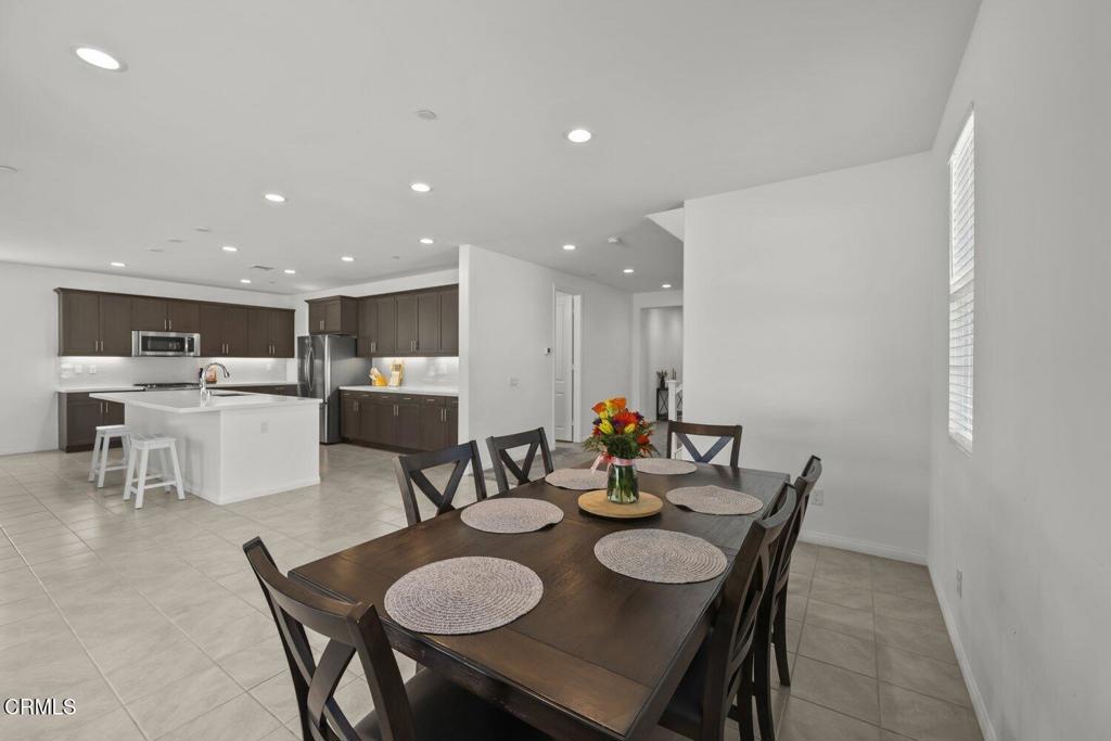 151 Rose Street Fillmore, CA 93015 - Photo 11 of 49 a dining room with furniture and a kitchen view