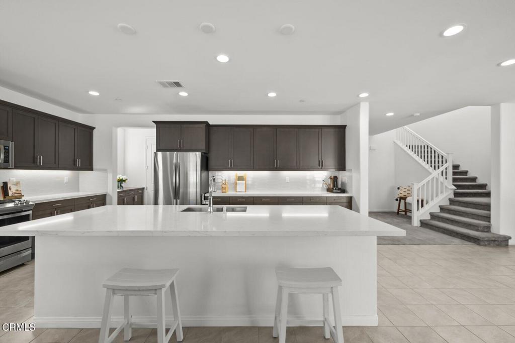 151 Rose Street Fillmore, CA 93015 - Photo 13 of 49 a large kitchen with stainless steel appliances a large counter top