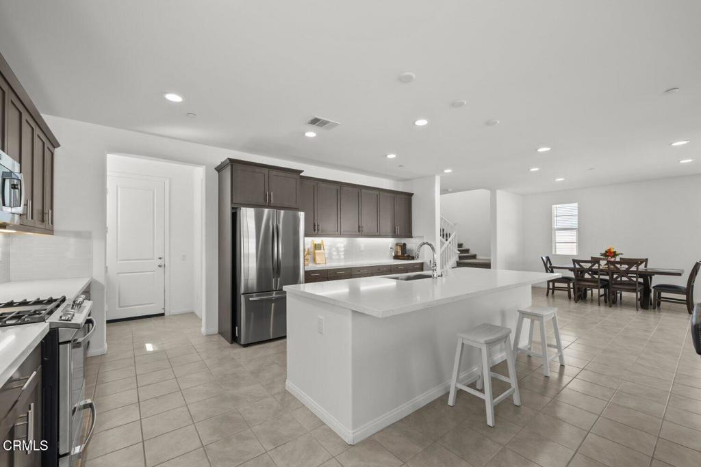 151 Rose Street Fillmore, CA 93015 - Photo 14 of 49 a large kitchen with a table and chairs
