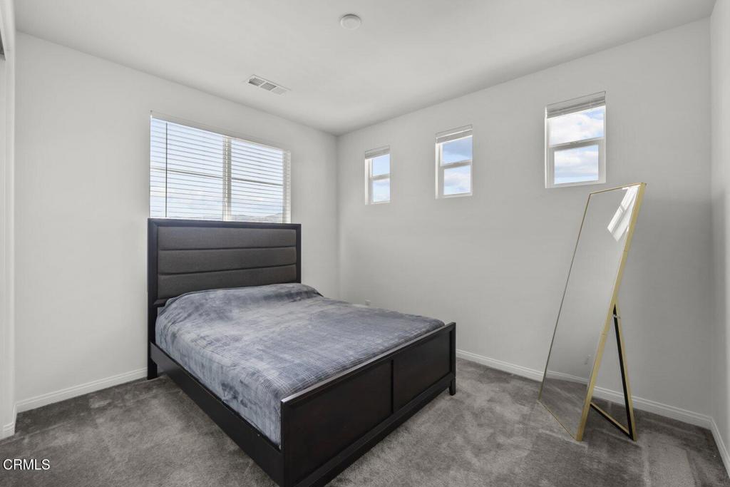 151 Rose Street Fillmore, CA 93015 - Photo 20 of 49 a bedroom with a bed and a window