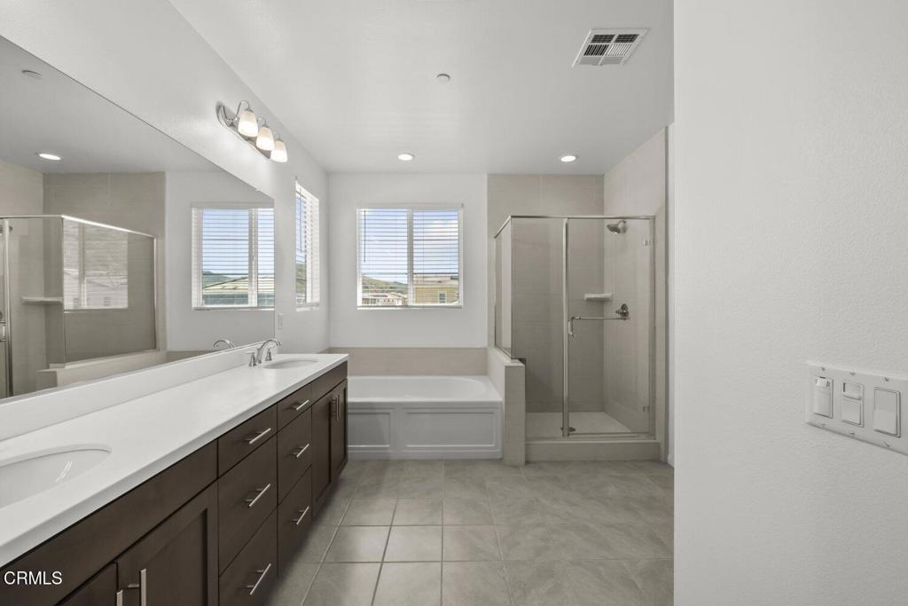 151 Rose Street Fillmore, CA 93015 - Photo 25 of 49 a spacious bathroom with a tub sink shower and mirror