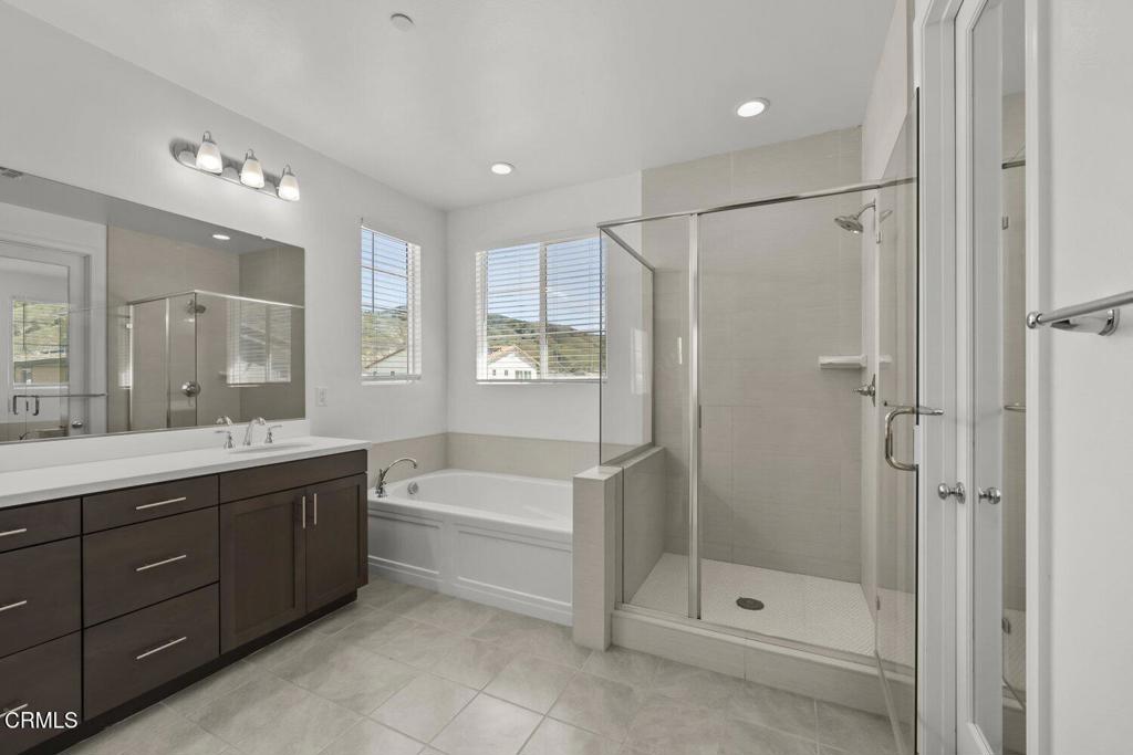 151 Rose Street Fillmore, CA 93015 - Photo 27 of 49 a bathroom with a tub a shower sink and mirror