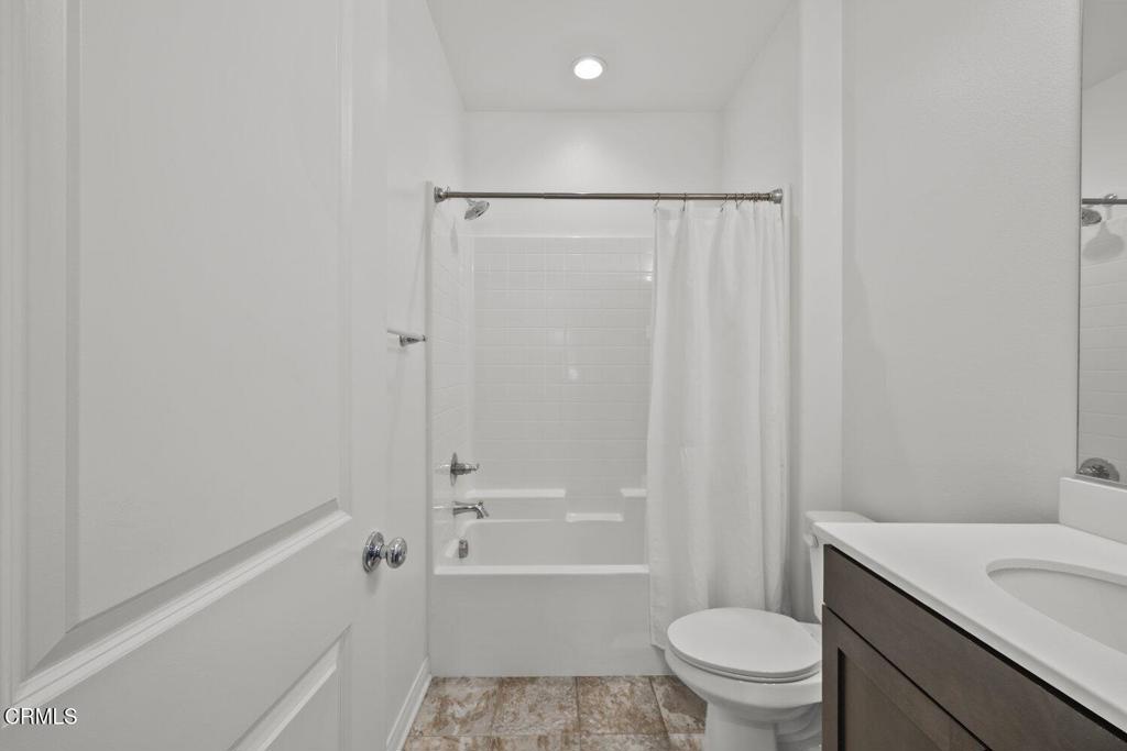 151 Rose Street Fillmore, CA 93015 - Photo 31 of 49 a bathroom with a granite countertop sink toilet and shower