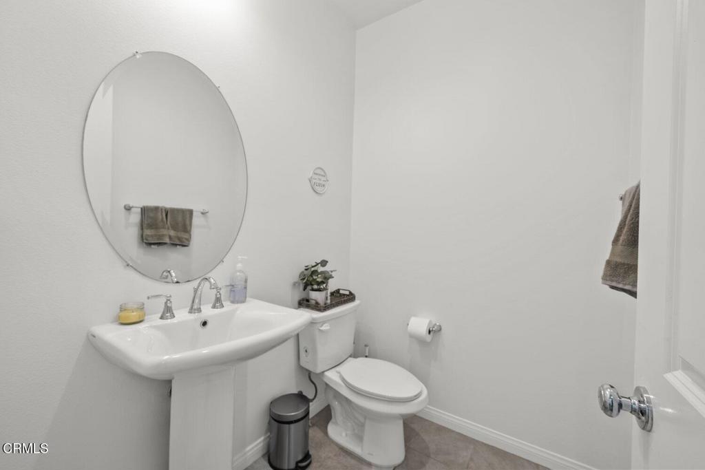 151 Rose Street Fillmore, CA 93015 - Photo 32 of 49 a bathroom with a sink mirror and toilet