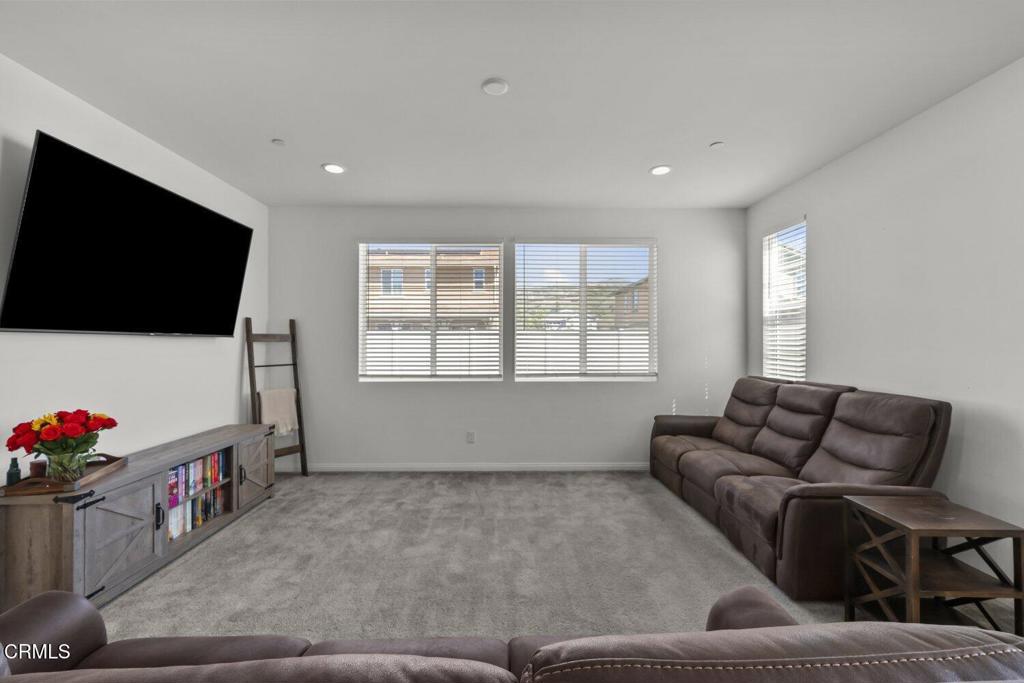 151 Rose Street Fillmore, CA 93015 - Photo 5 of 49 a living room with furniture and a flat screen tv