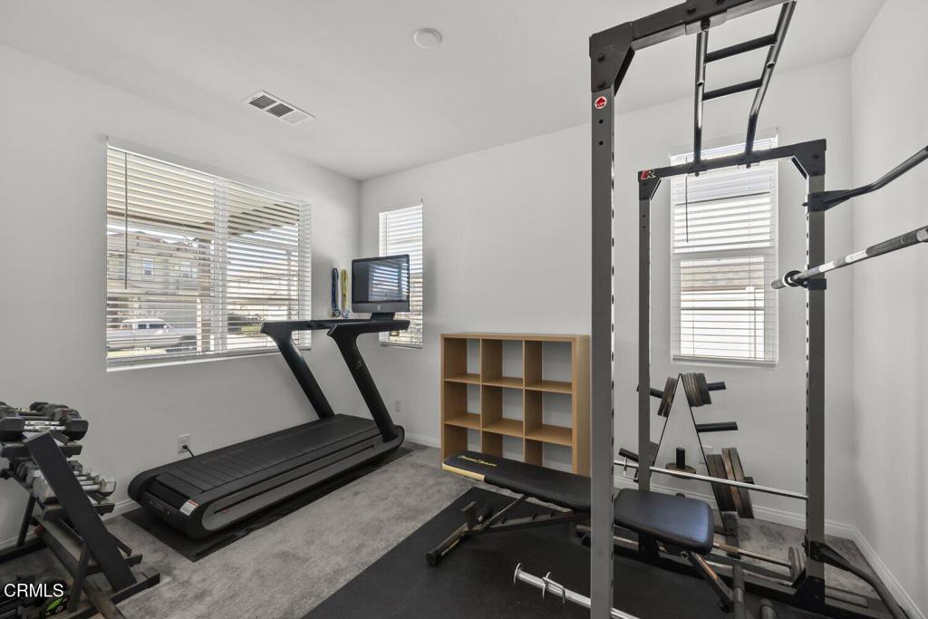 151 Rose Street Fillmore, CA 93015 - Photo 9 of 49 a room with gym equipment and a window