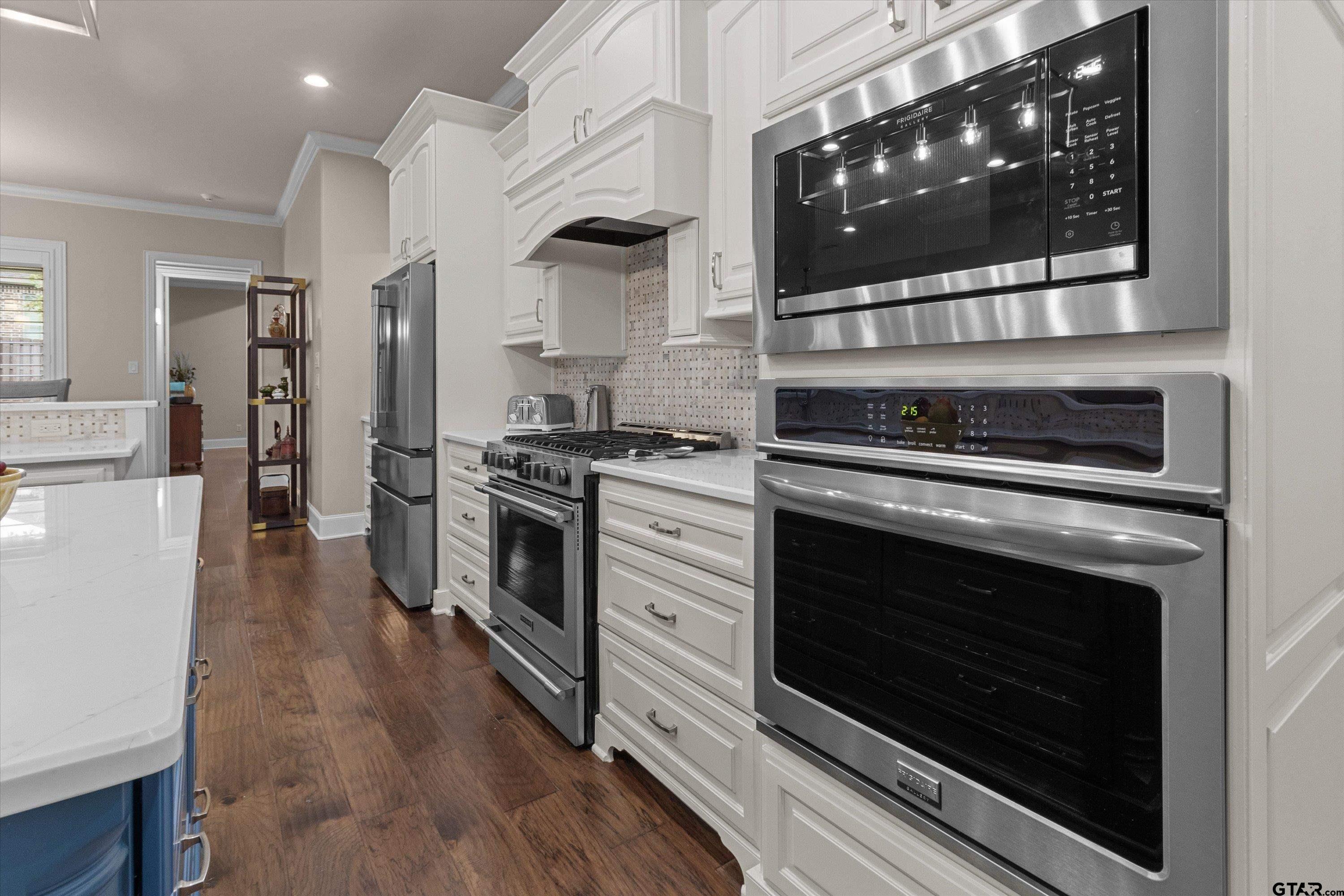 7423 Princedale Tyler, TX 75703 - Photo 11 of 31 a kitchen with stainless steel appliances white cabinets and a stove