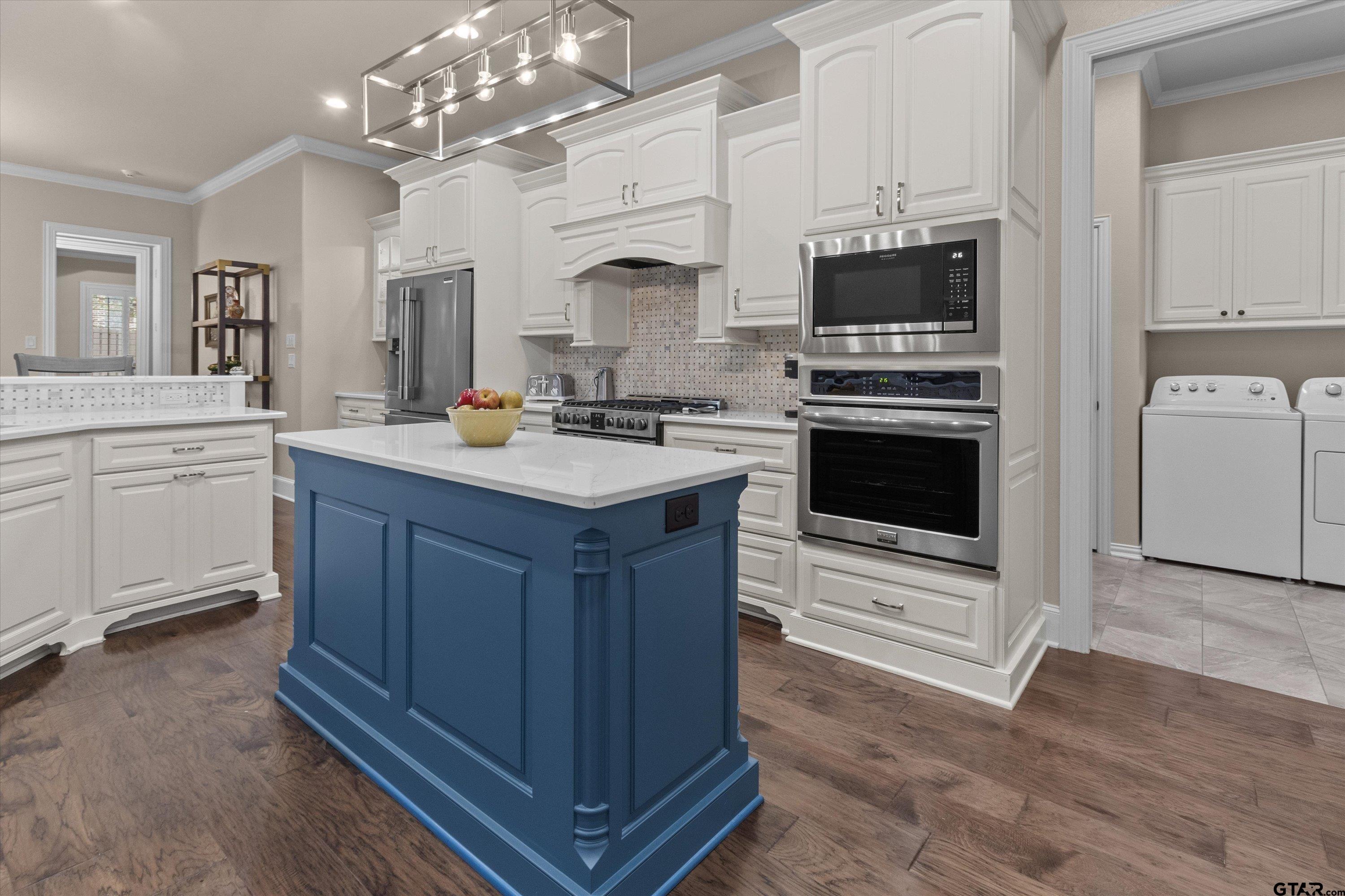 7423 Princedale Tyler, TX 75703 - Photo 13 of 31 a kitchen with stainless steel appliances a stove a sink and a refrigerator