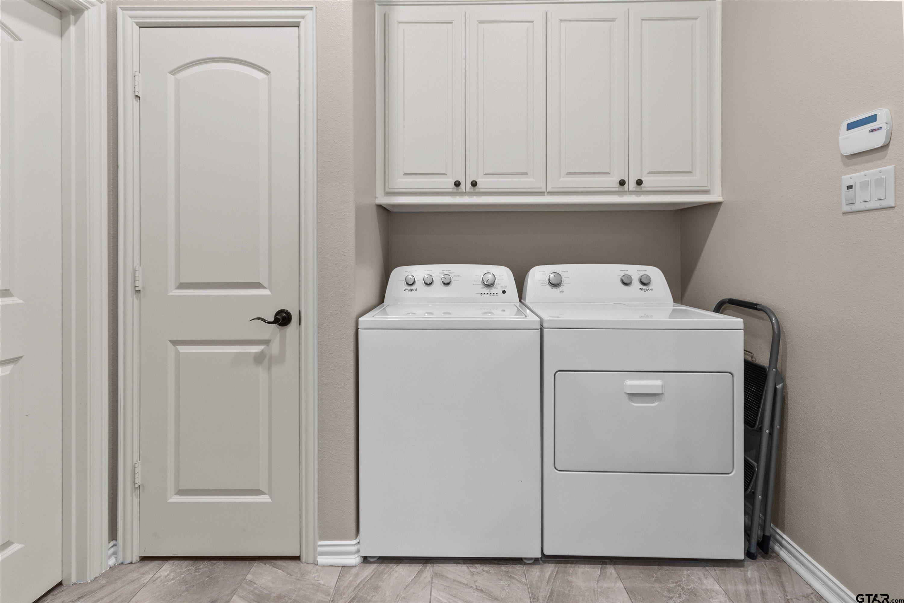 7423 Princedale Tyler, TX 75703 - Photo 16 of 31 a utility room with dryer and washer