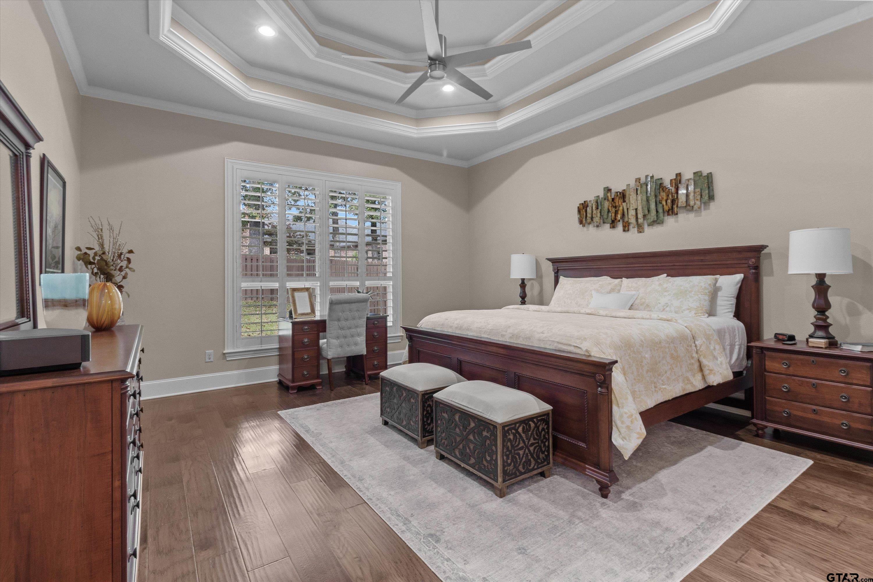 7423 Princedale Tyler, TX 75703 - Photo 17 of 31 a spacious bedroom with a bed and wooden floor