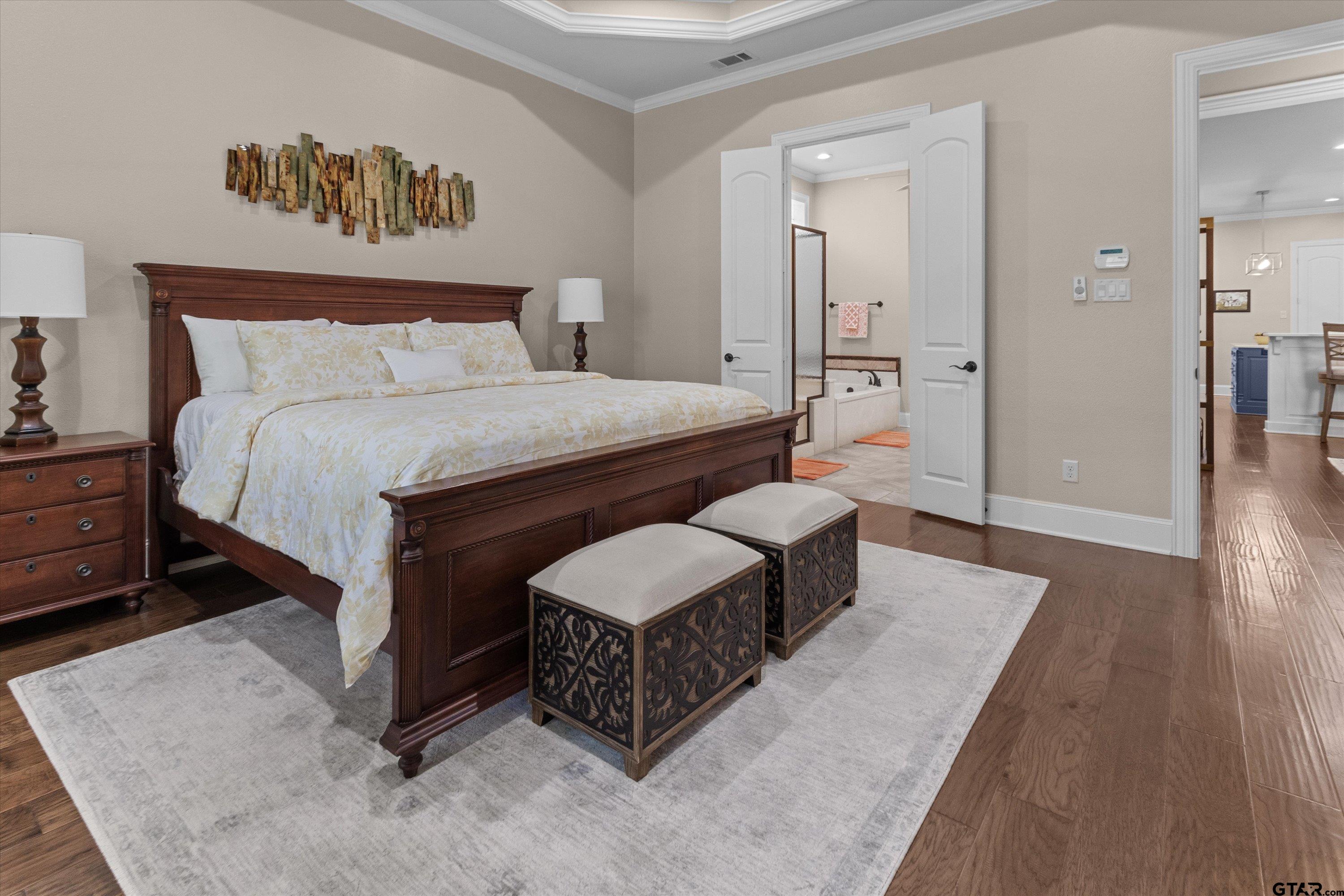 7423 Princedale Tyler, TX 75703 - Photo 18 of 31 a bedroom with a bed a mirror and lamp