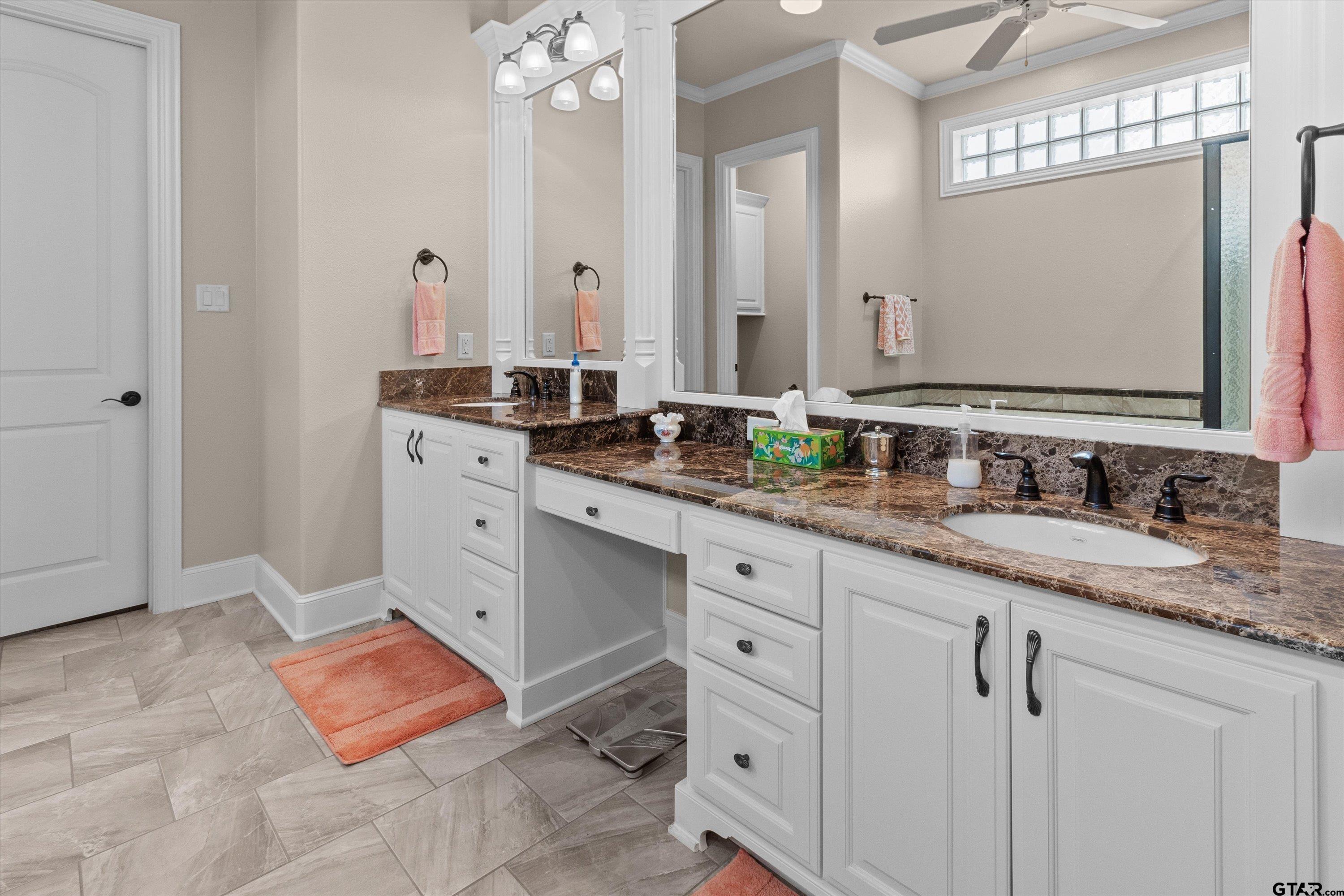 7423 Princedale Tyler, TX 75703 - Photo 21 of 31 a bathroom with double sink and a mirror