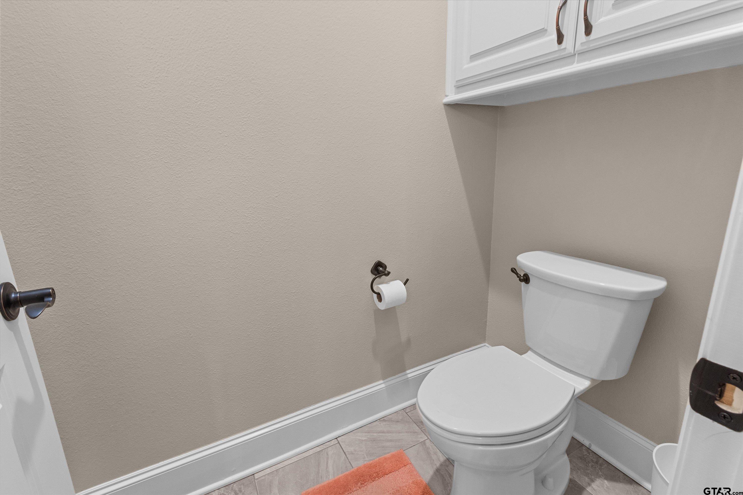 7423 Princedale Tyler, TX 75703 - Photo 23 of 31 a white toilet sitting next to a shower