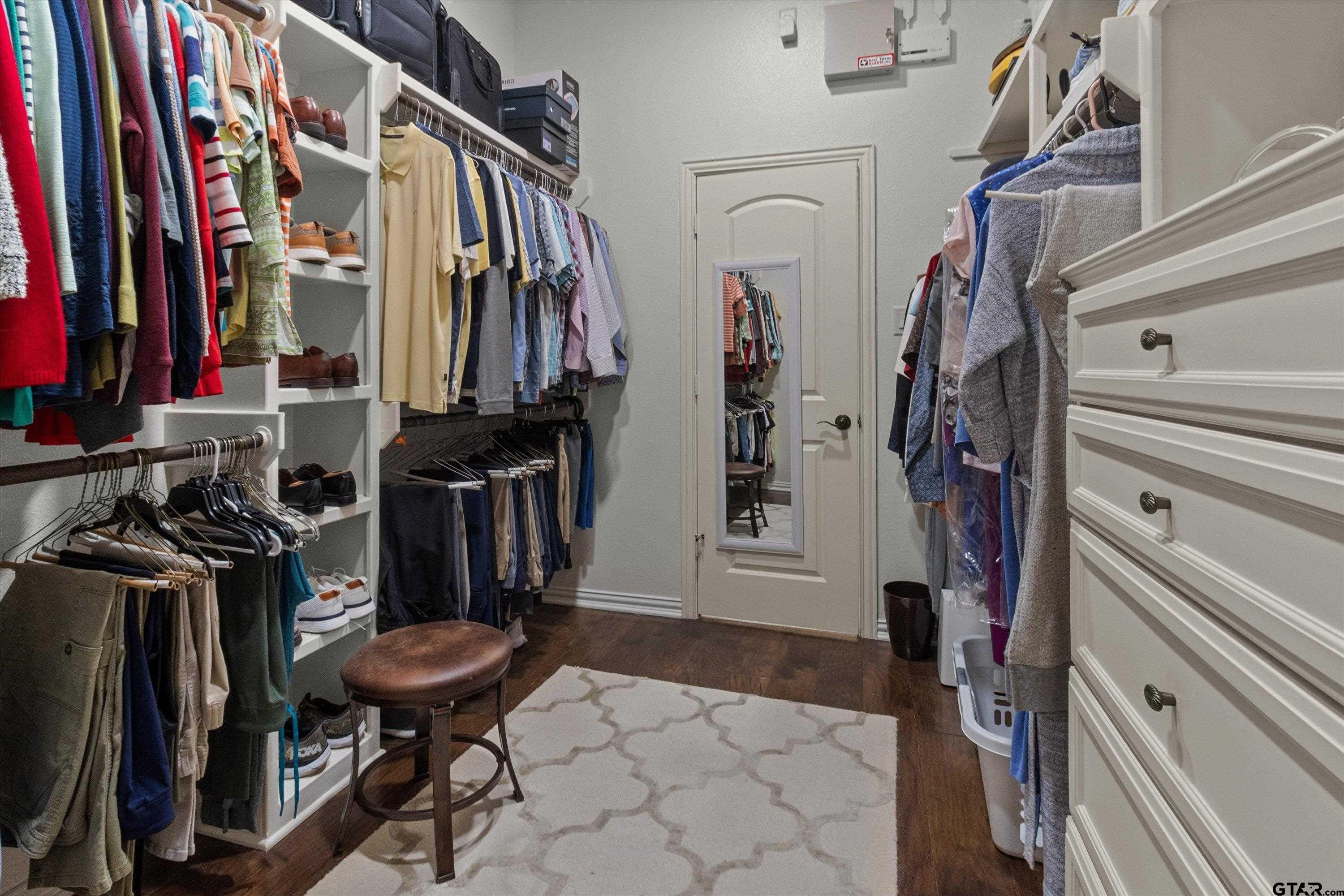 7423 Princedale Tyler, TX 75703 - Photo 24 of 31 a view of walk in closet with clothes and shoes