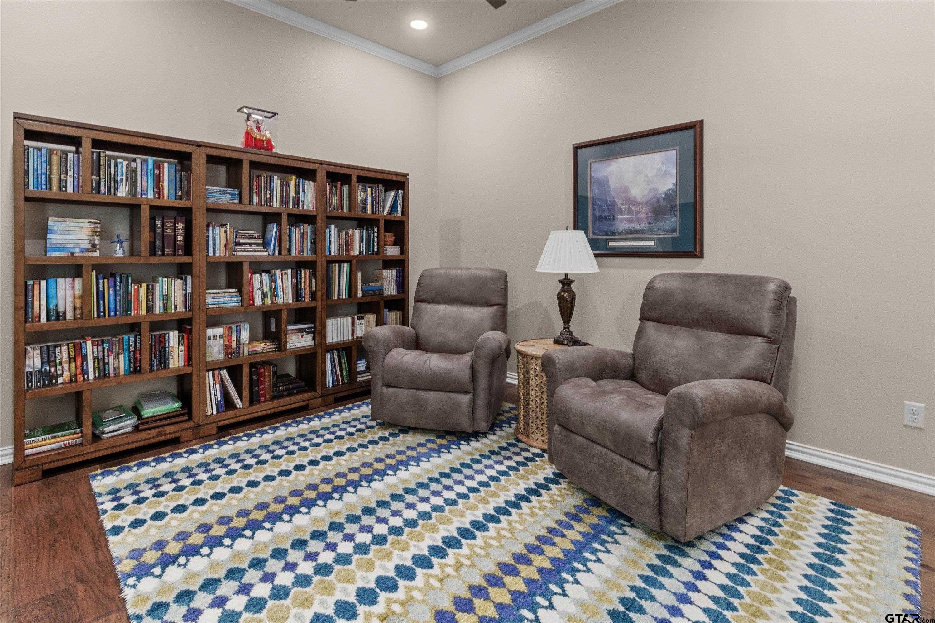 7423 Princedale Tyler, TX 75703 - Photo 29 of 31 a living room with furniture and a book shelf