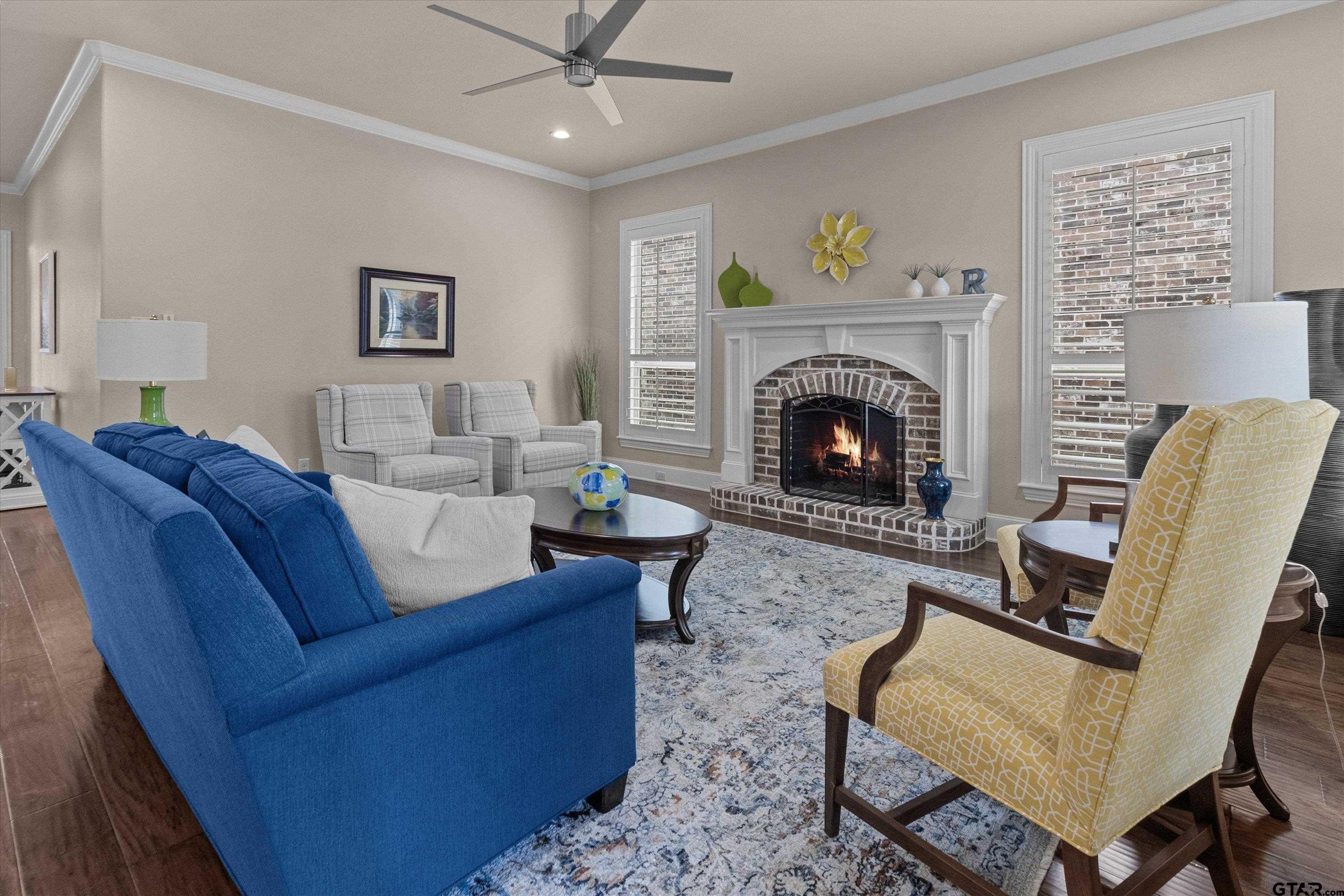 7423 Princedale Tyler, TX 75703 - Photo 7 of 31 a living room with furniture and a fireplace