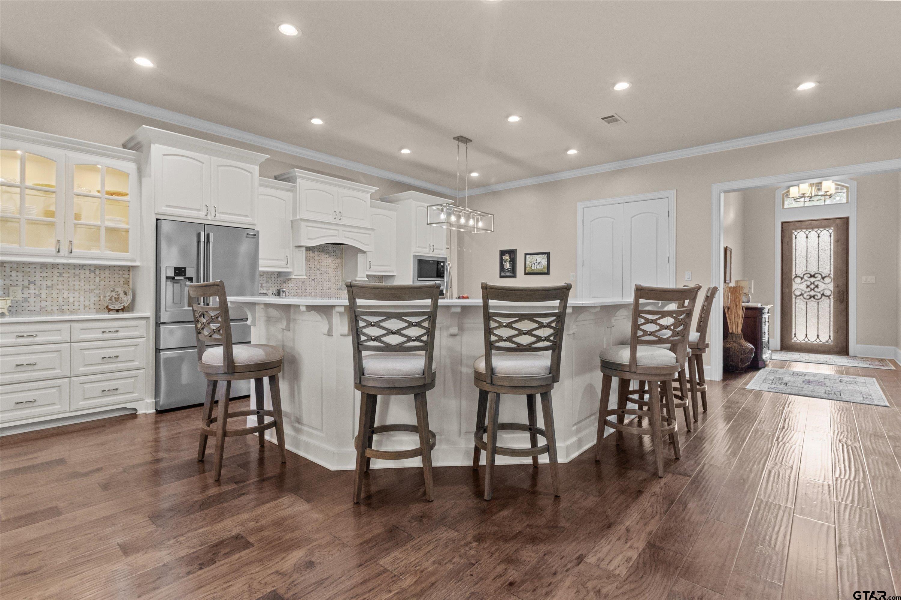 7423 Princedale Tyler, TX 75703 - Photo 9 of 31 a view of a dining room with furniture and wooden floor