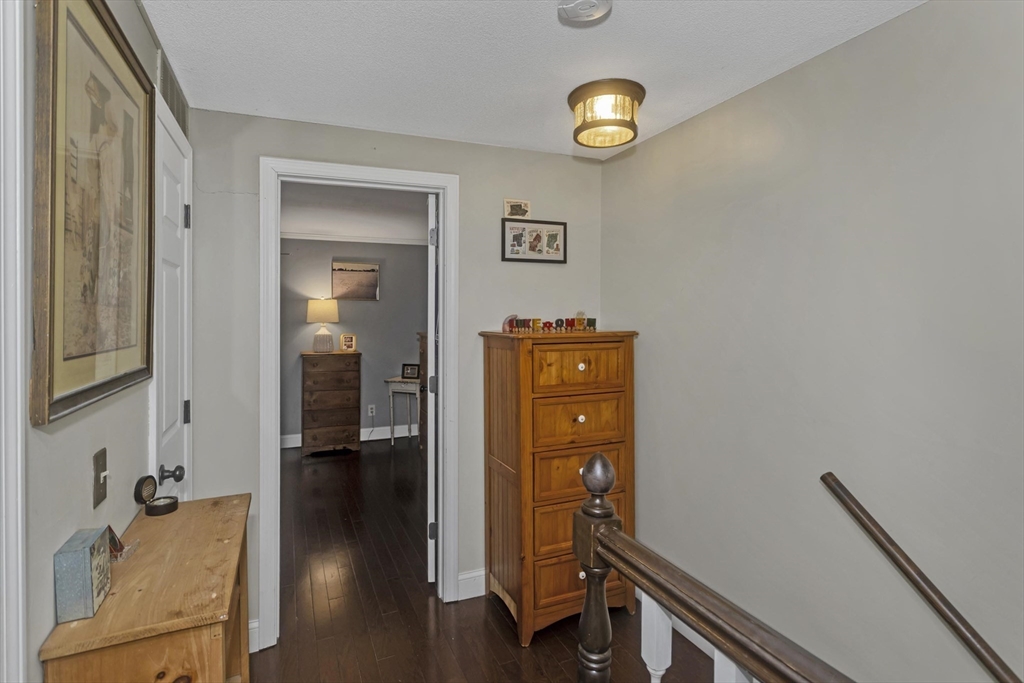 70 Corey Colonial, Unit 70 Agawam, MA 01001 - Photo 16 of 23 a view of a hallway with workspace and wooden floor