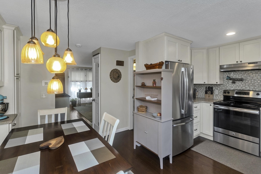 70 Corey Colonial, Unit 70 Agawam, MA 01001 - Photo 5 of 23 a kitchen with refrigerator and window