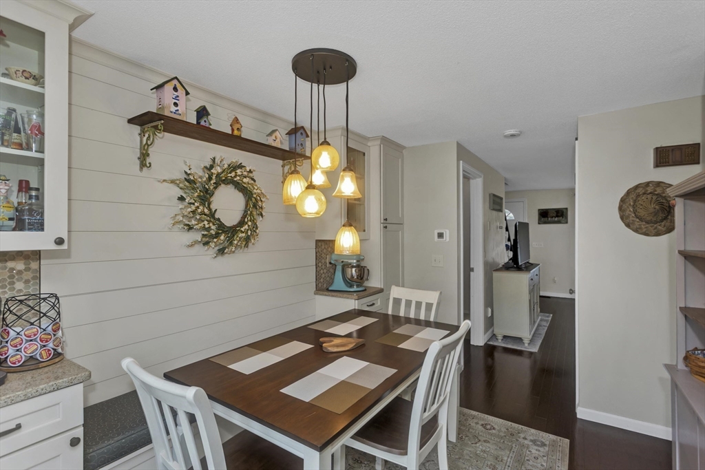 70 Corey Colonial, Unit 70 Agawam, MA 01001 - Photo 8 of 23 a view of a dining room with furniture and chandelier