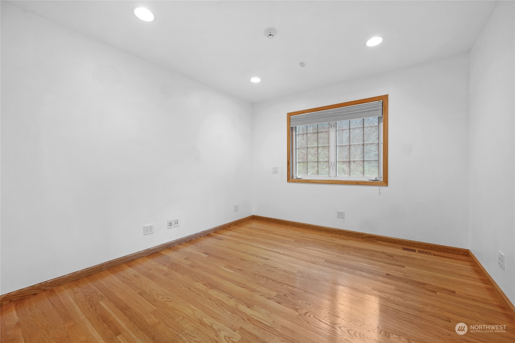 33233 Northeast 70th Street Carnation, WA 98014 - Photo 16 of 30 a view of an empty room with wooden floor and a window