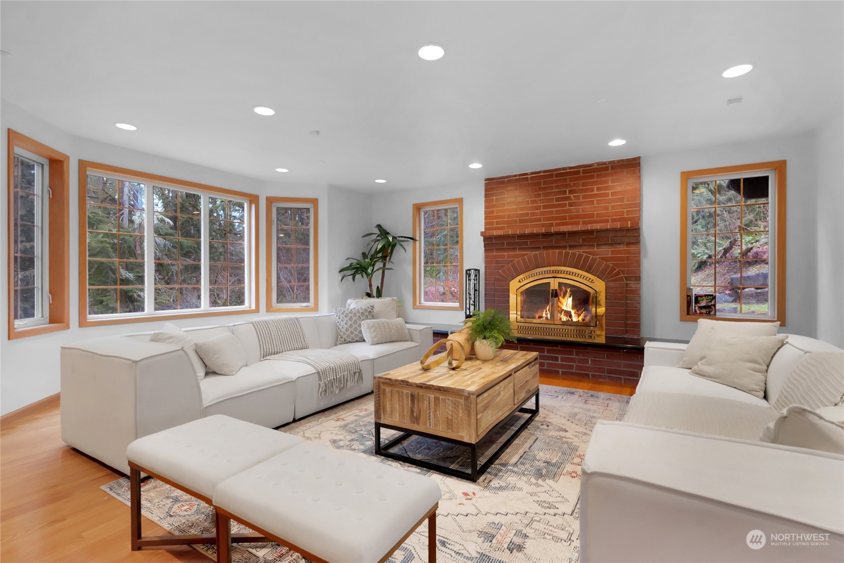 33233 Northeast 70th Street Carnation, WA 98014 - Photo 4 of 30 a living room with furniture a fireplace and a large window