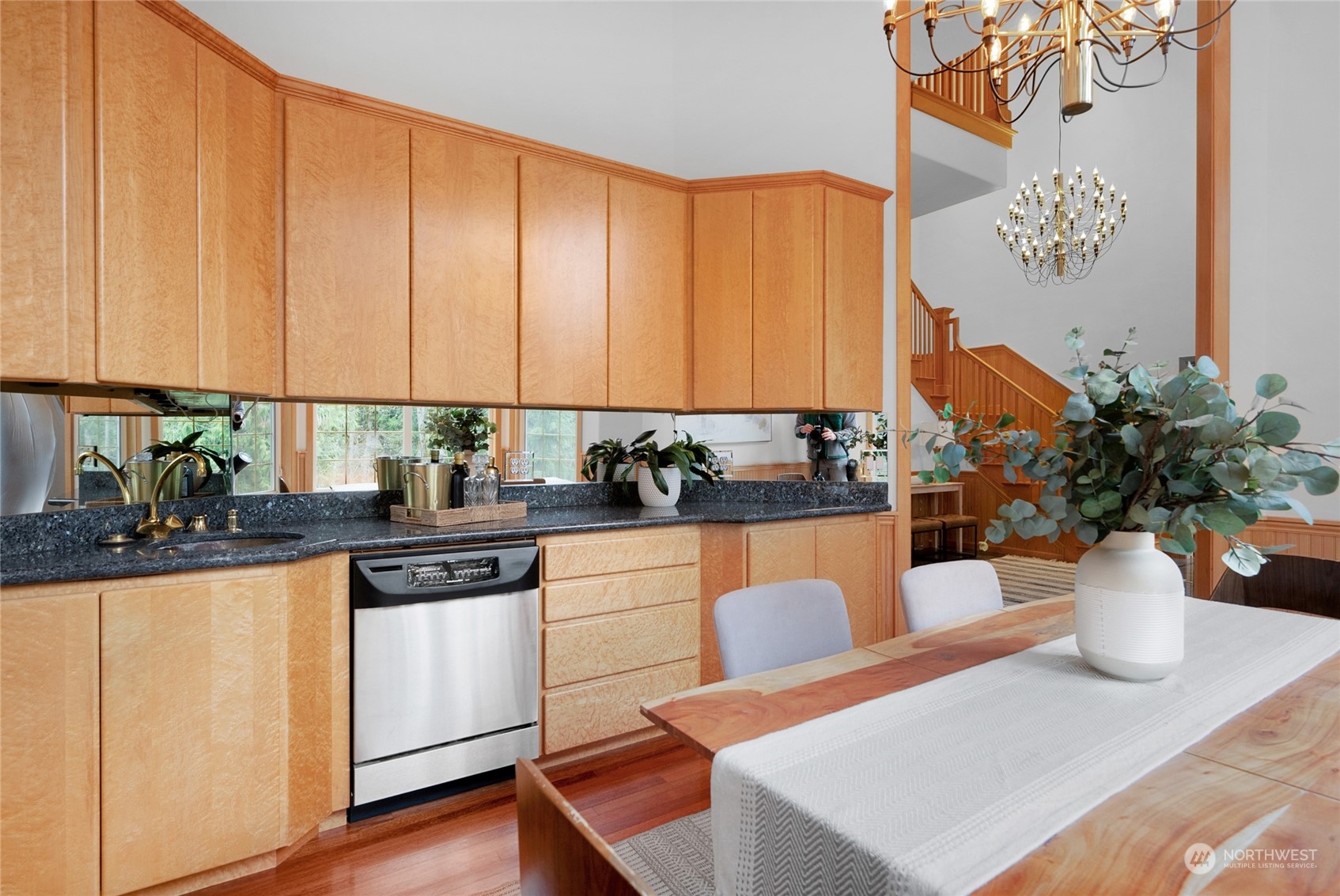 33233 Northeast 70th Street Carnation, WA 98014 - Photo 6 of 30 a view of a kitchen with dining table and chairs