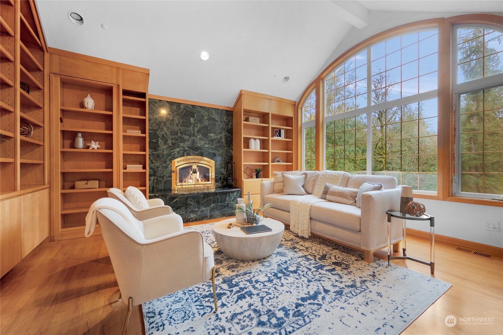 33233 Northeast 70th Street Carnation, WA 98014 - Photo 7 of 30 a living room with furniture and a floor to ceiling window