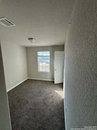 a view of a livingroom and a window