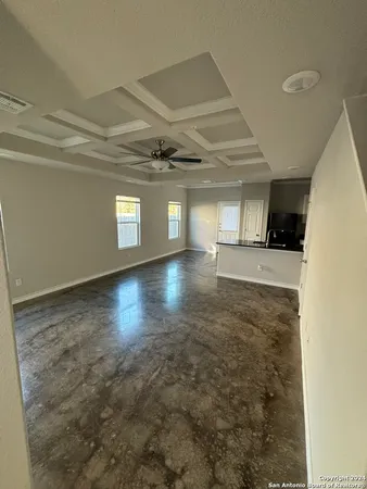 a view of a hall with wooden floor