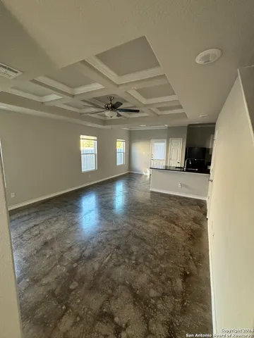 a view of a hall with wooden floor