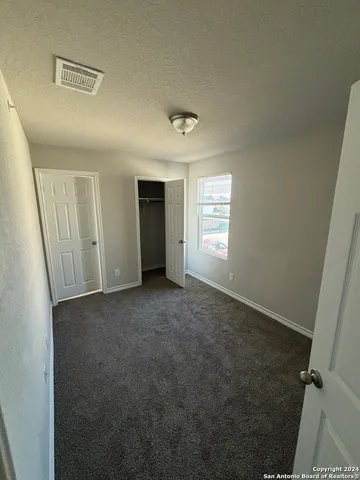 a view of empty room with windows