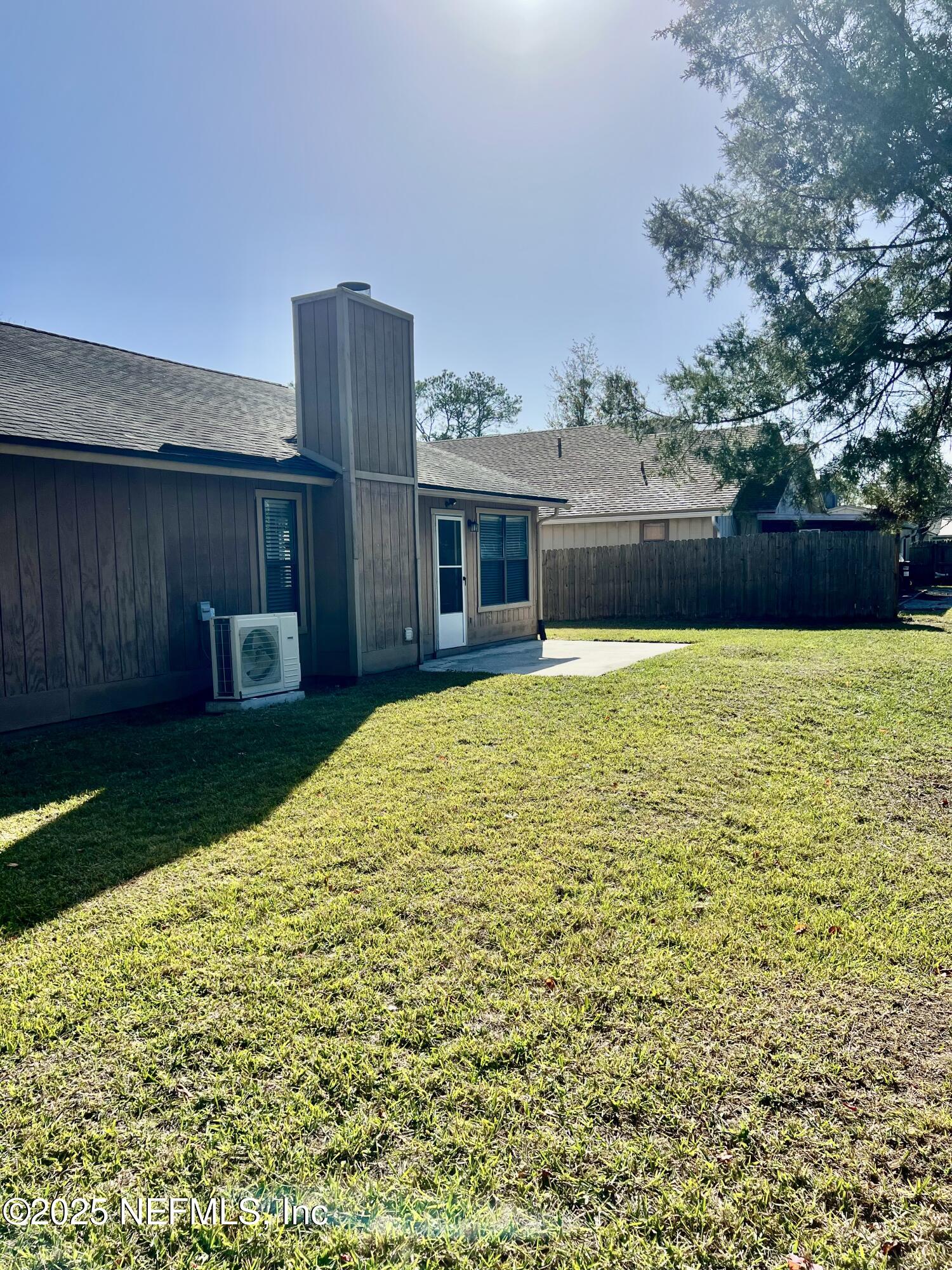 7820 Collins Ridge Boulevard East Jacksonville, FL 32244 - Photo 15 of 18 a view of a house with a yard and potted plants