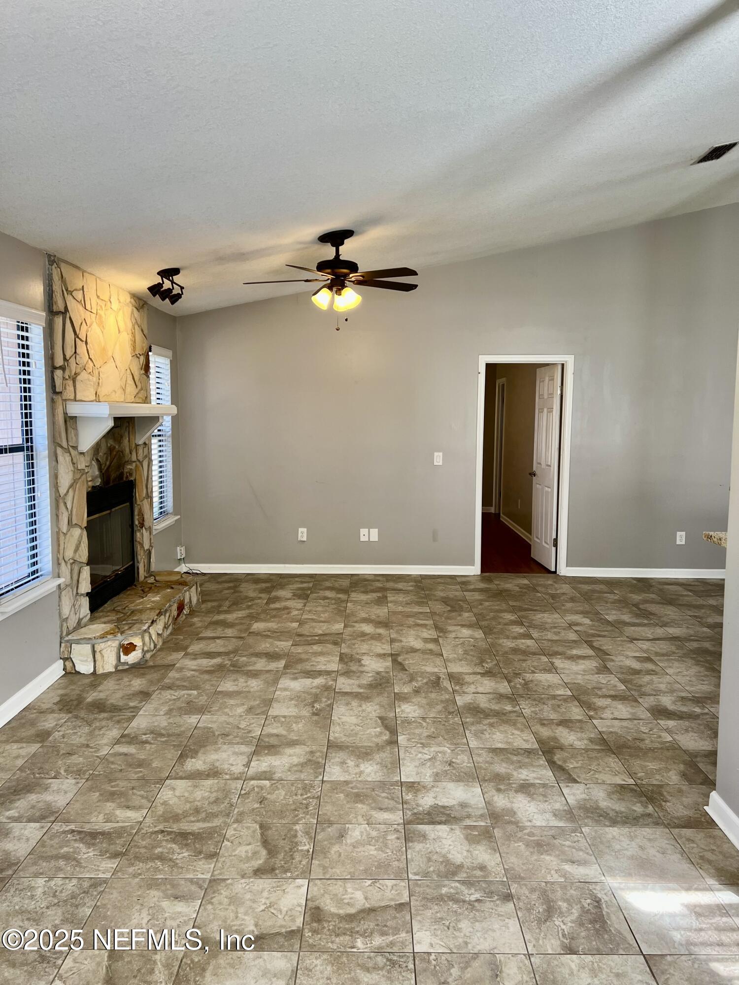 7820 Collins Ridge Boulevard East Jacksonville, FL 32244 - Photo 16 of 27 a view of a livingroom with a fireplace