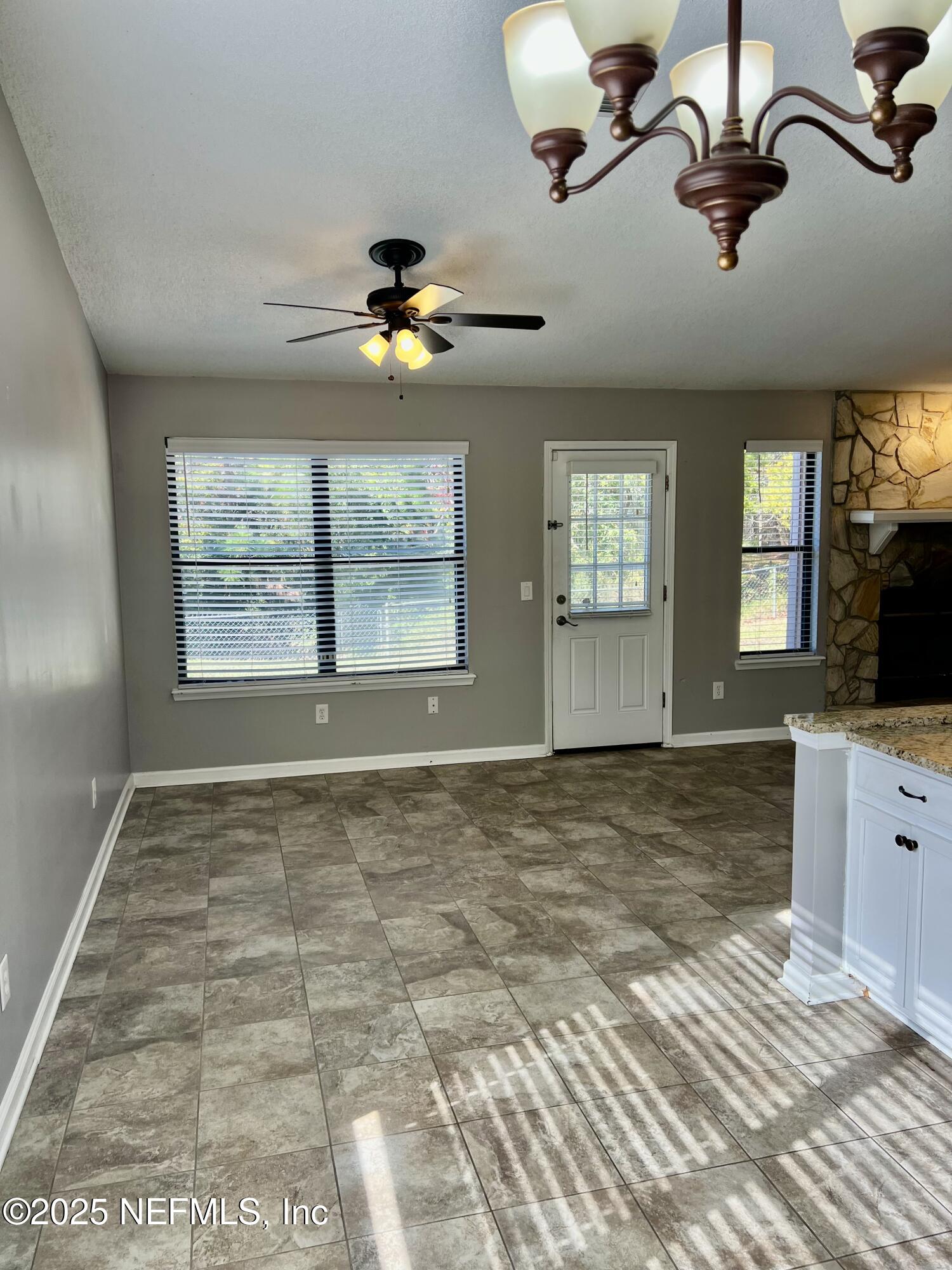 7820 Collins Ridge Boulevard East Jacksonville, FL 32244 - Photo 5 of 18 a view of an empty room with a window