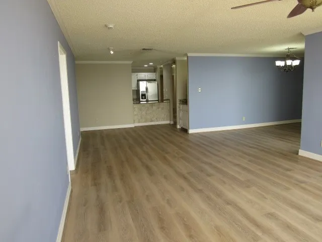 wooden floor in a hall with an entryway