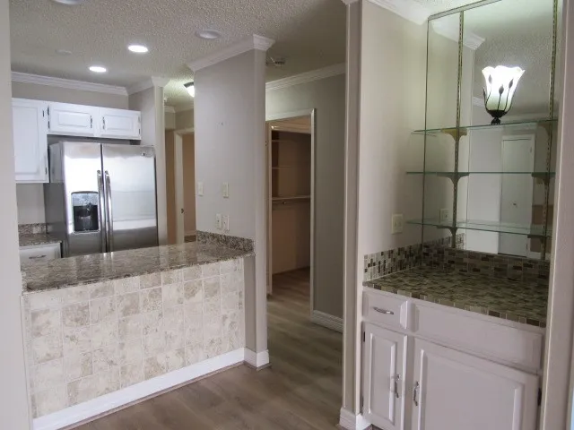 a view of a bathroom with a granite countertop sink