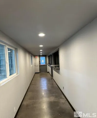 a view of a hallway with the kitchen