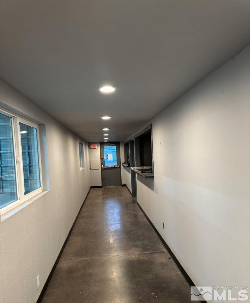 5050 East Winnemucca Boulevard Winnemucca, NV 89445 - Photo 6 of 9 a view of a hallway with the kitchen