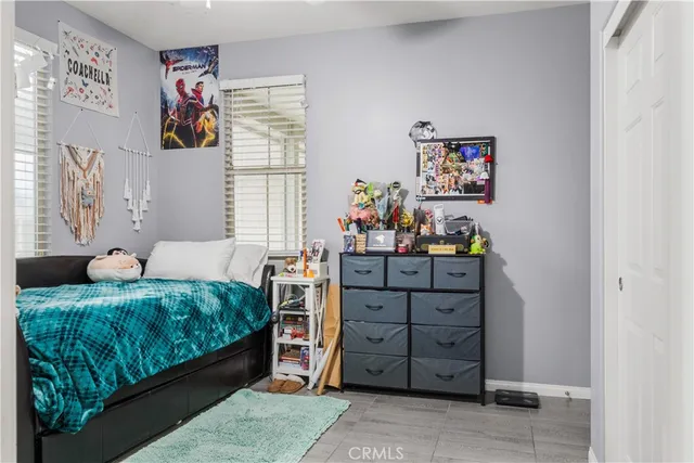 a bathroom with double vanity sinks a vanity and a mirror