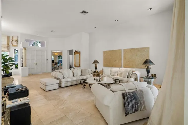 a kitchen with stainless steel appliances granite countertop a sink refrigerator and cabinets