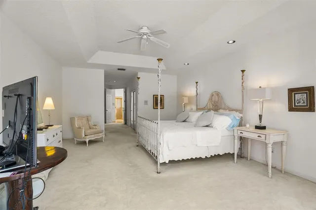 an aerial view of residential houses with outdoor space and river