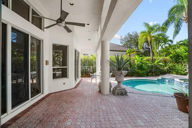an aerial view of residential houses with outdoor space and river