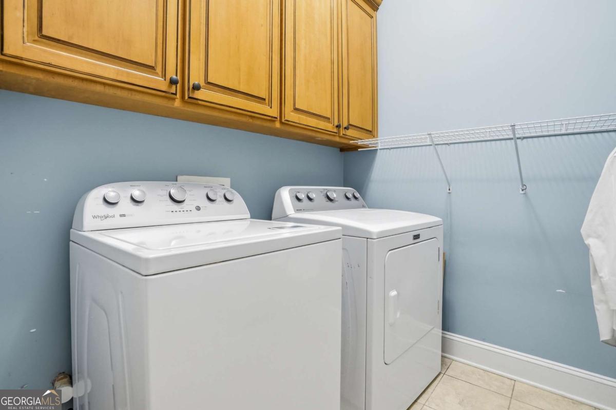 135 Stewart Street St. Simons, GA 31522 - Photo 13 of 27 a utility room with dryer and washer