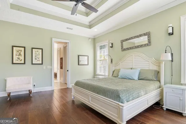 a bedroom with a bed and a table