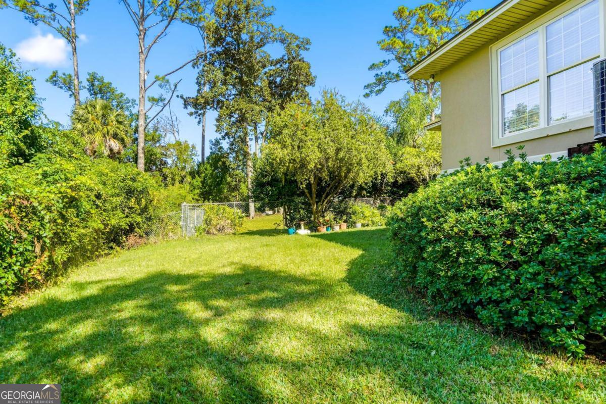 135 Stewart Street St. Simons, GA 31522 - Photo 27 of 27 a view of yard with green space