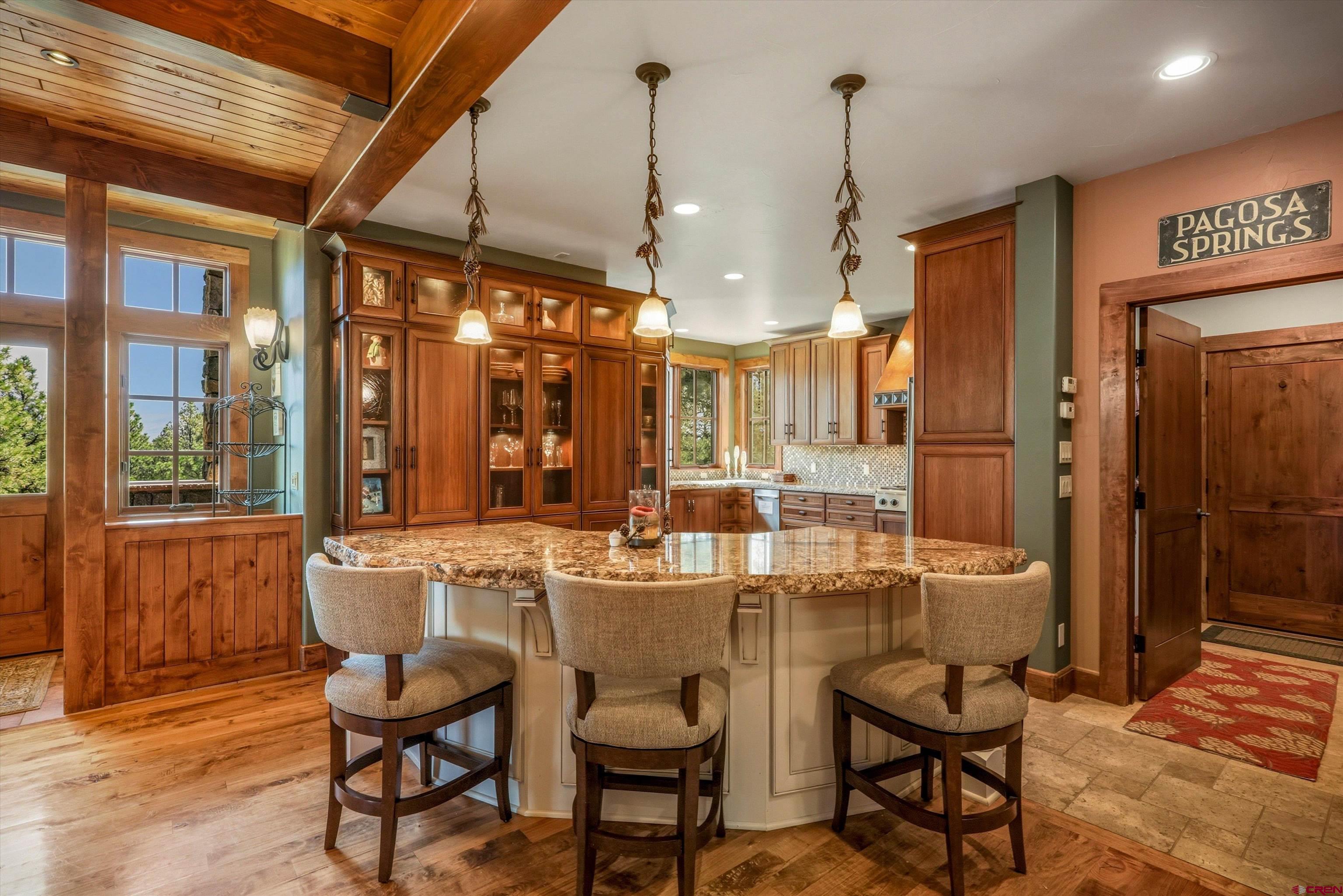 171 South Squaw Canyon Place Pagosa Springs, CO 81147 - Photo 13 of 45 a dining area with furniture and window