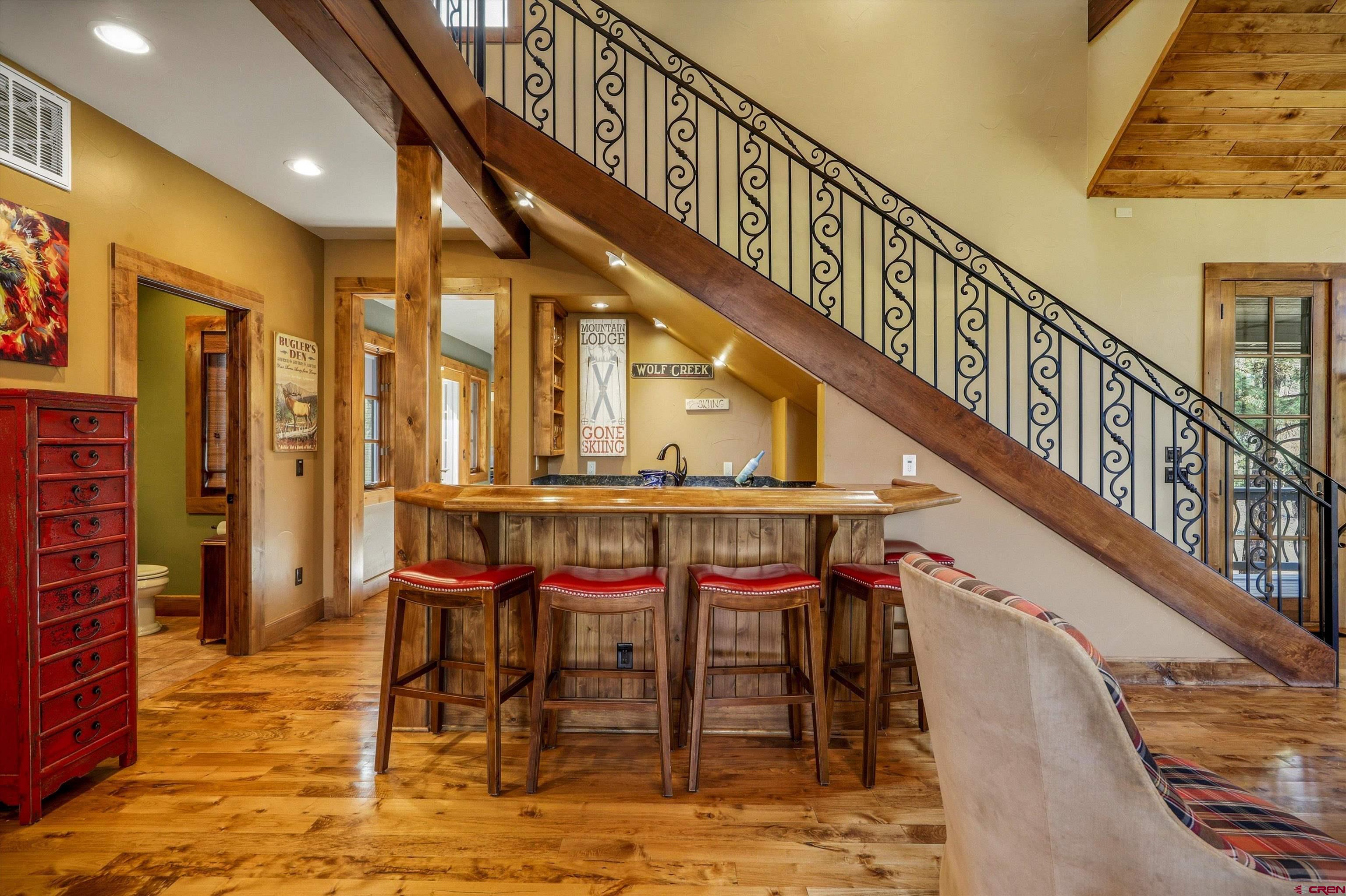 171 South Squaw Canyon Place Pagosa Springs, CO 81147 - Photo 19 of 45 a dining room with furniture and a floor to ceiling window
