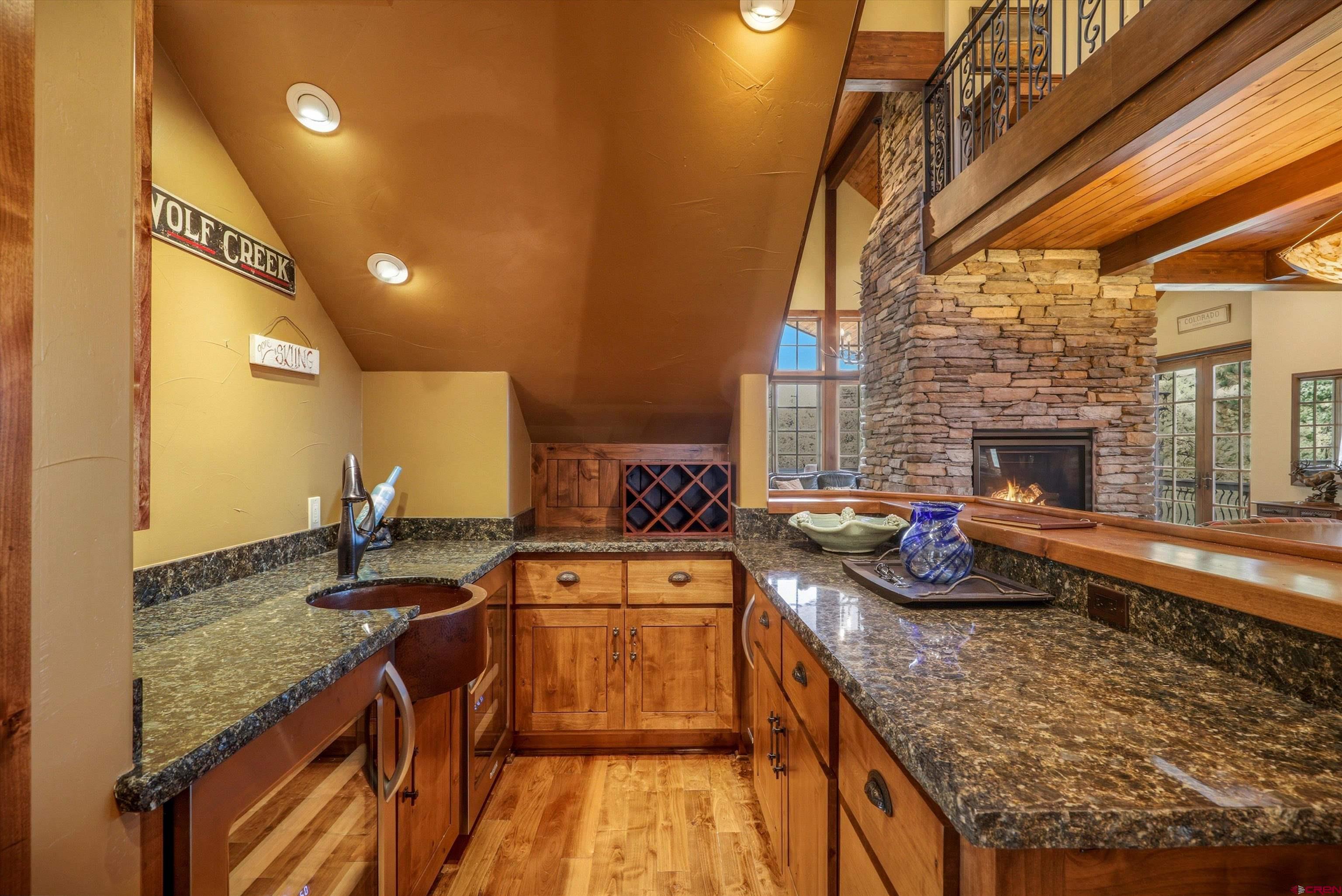 171 South Squaw Canyon Place Pagosa Springs, CO 81147 - Photo 20 of 45 a kitchen with sink a stove and cabinets